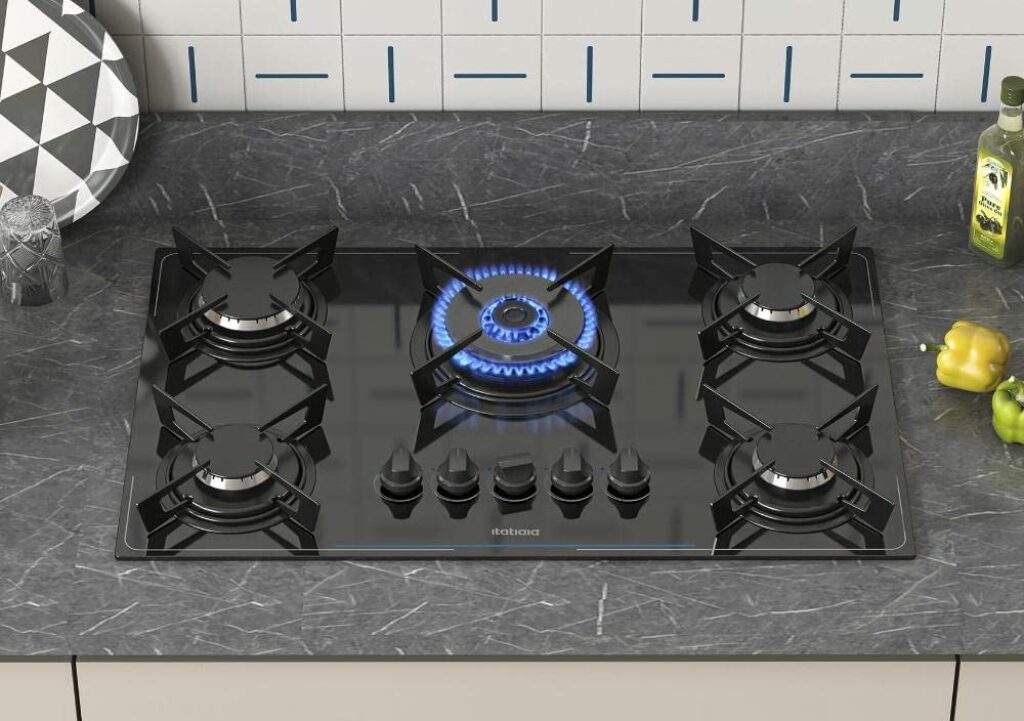 Melhor cooktop 5 bocas com queimador central aceso.